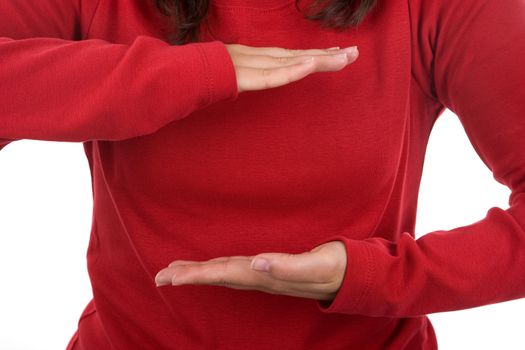 woman in red shirt with arms in holding position. landscape orientation.