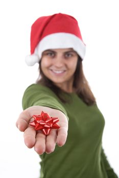 Young Christmas santa woman holding red ribbon in the hand. isolated on white background. Portrait orientation.