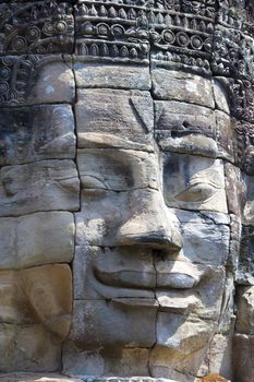 Image of Buddha's face at UNESCO's World Heritage Site of Bayon, which is part of the larger temple complex of Angkor Thom, located at Siem Reap, Cambodia. This is one of the temples in Siem Reap where the Hollywood movie Lara Croft Tomb Raider was filmed at.