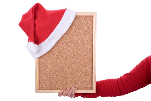 hand holding empty frame with red santa hat. isolated on white background. landscape orientation.