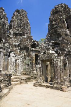 Image of UNESCO's World Heritage Site of Bayon, which is part of the larger temple complex of Angkor Thom, located at Siem Reap, Cambodia. This is one of the temples in Siem Reap where the Hollywood movie Lara Croft Tomb Raider was filmed at.