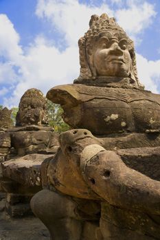 Image of ancient demon statues at the South Gate of UNESCO's World Heritage Site of Angkor Thom, Siem Reap, Cambodia. 