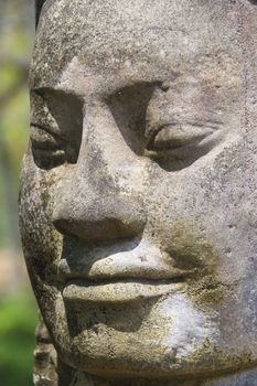 Image of an ancient god statue at the South Gate of UNESCO's World Heritage Site of Angkor Thom, Siem Reap, Cambodia. 