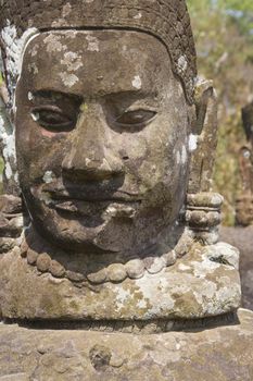 Image of an ancient god statue at the South Gate of UNESCO's World Heritage Site of Angkor Thom, Siem Reap, Cambodia. 