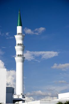 Image of a minaret of a modern mosque in Malaysia.