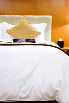 Image of a comfortable looking hotel bed.