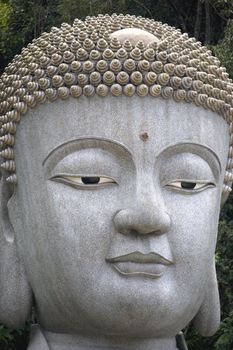 Giant granite Buddha statue in Malaysia.