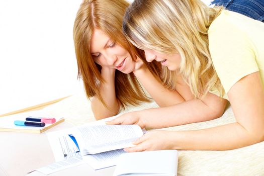 Beautiful girls learning; reading from books