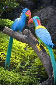 Image of a pair of artifical cockatoos.