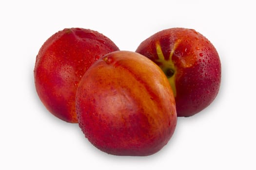 three peaches on white background