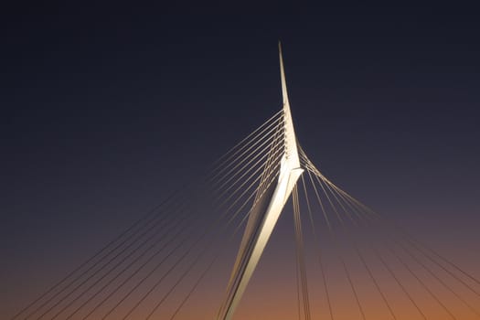 lighted bridge on sunset sky background