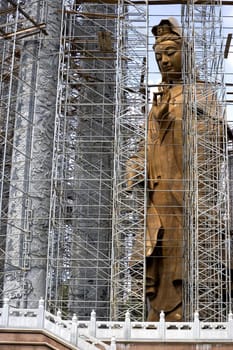 Image of a massive Chinese temple with a giant Goddess of Mercy Statue under construction in Malaysia.