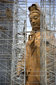 Image of a massive Chinese Goddess of Mercy Statue under construction in Malaysia.