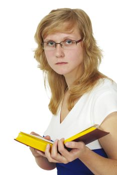 The woman wearing spectacles reads the book
