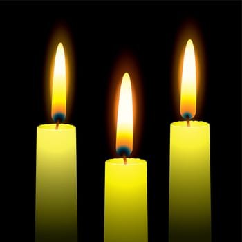 Three burning candles with yellow wax and outer glow