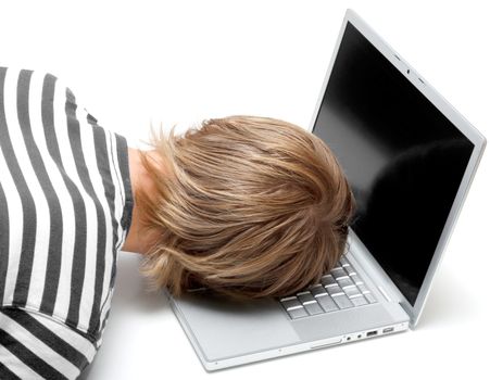 A man sleeping on his laptop