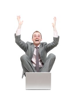 Ecstatic business man at his laptop