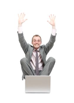 Ecstatic business man at his laptop