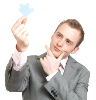 A business man solving a puzzle