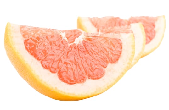 close-up grapefruit peaces, isolated on white