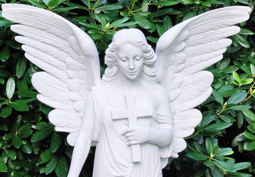Angel statue to a cemetery