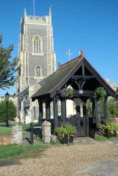 Typical English parish church with lych gate in foreground