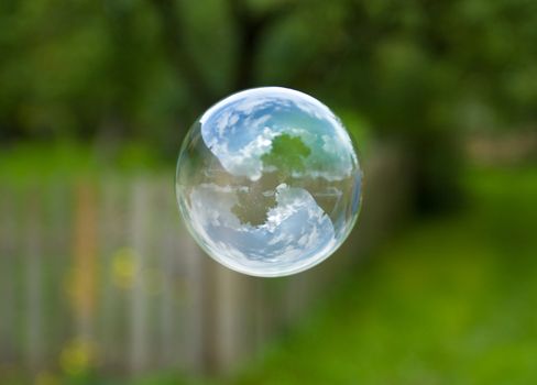 close-up soap bubble on green background