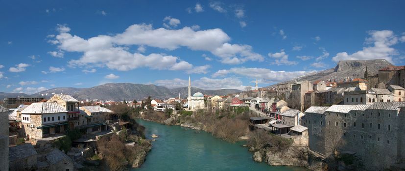 Panorama of Neretva river in Mostar Old Town on a sunny winter day.