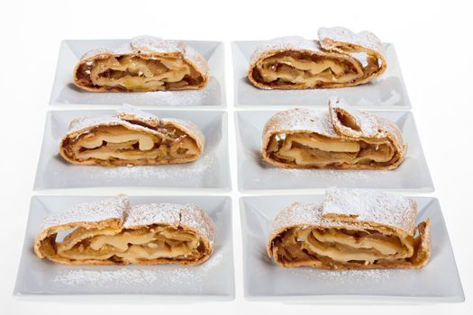 detail of an apple strudel with icing sugar