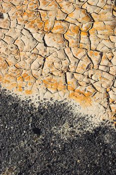 Fragment of  orange clay and salt mineral deposits in geological formations in Ubehebe Volcano, Death Valley National Park