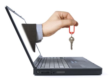 A man's hand with a key comes from the laptop screen. Isolated over white background.