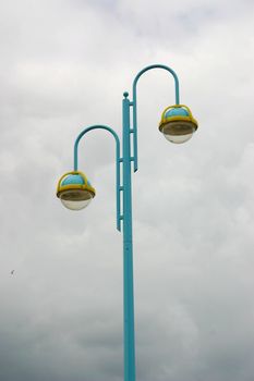 street light against a cloudy sky