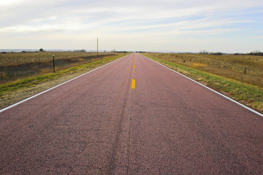 Roads in countryside surrounded by colorful fields and meadows