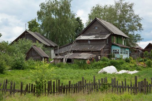 Old dilapidated rustic wooden houses - Russia, summer