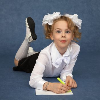 Teen paints lying on a blue background