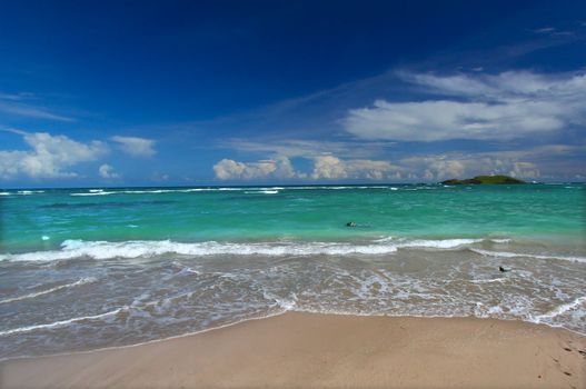 Waves wash ashore at the beach on the Caribbean island of Saint Lucia.