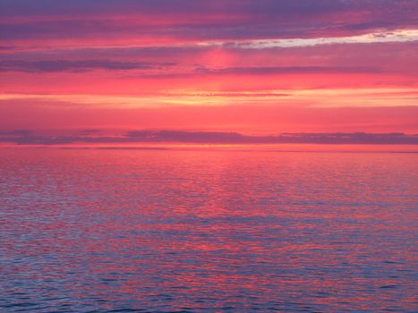 Beautiful pink colors reflect off Lake Superior in northern Michigan.