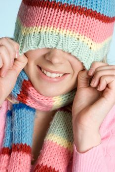 Playful smiling winter hat girl