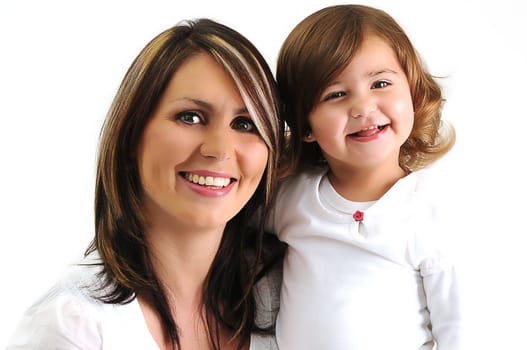 beautiful young mother and daughter hugging and smiling