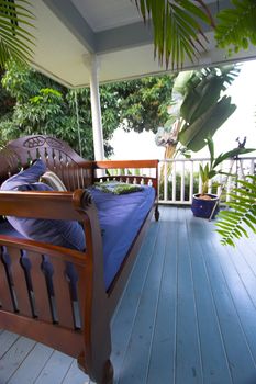 White balcony and plants in Hawaii exotic setting