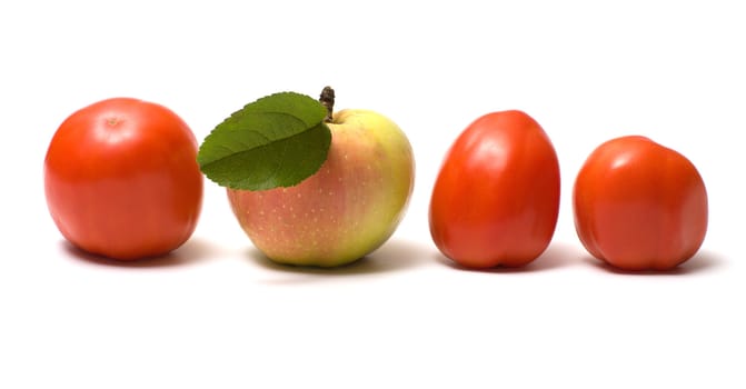 Three red tomato and apple on a white background.