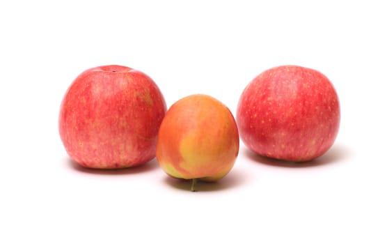 Three ripe apples isolated on a white background.
