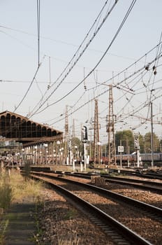 Station with electrical cables and rails
