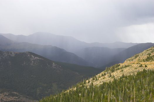 Rain and thunderclouds in the mountains tundtra prairies forests of Cordeliers 