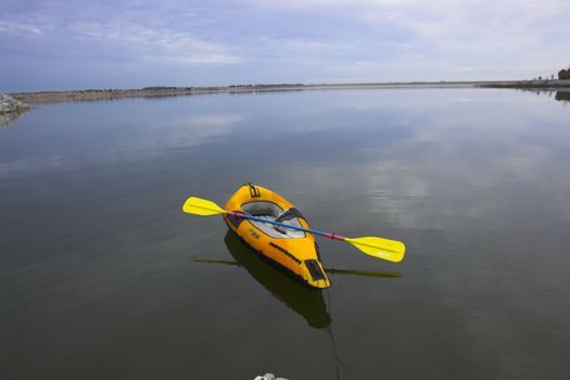 Orange kayak on the lake at sunset in Nebraska
