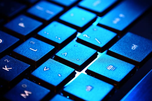 blue keyboard of the personal computer closeup