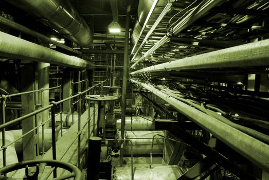 Boilers, ladders and pipes at a power plant     