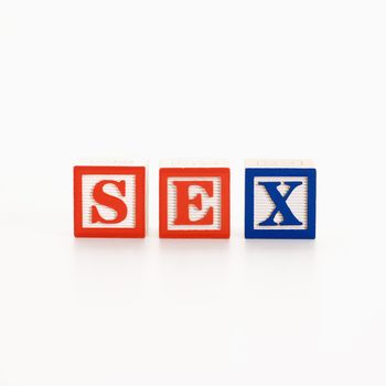 Alphabet toy building blocks spelling the word sex.