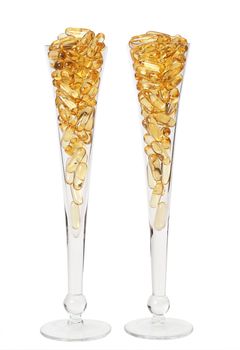 Two glasses with gold shiny boluses