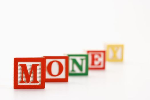 Alphabet toy building blocks spelling the word money.